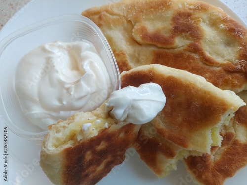 Canvastavla Cut-open homemade pie revealing savory potato and mushroom filling, rustic traditional food