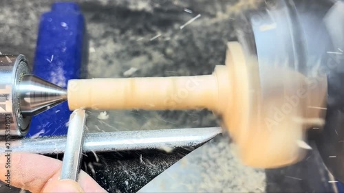 Close up of woodturning on a workshop lathe