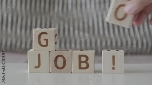 good job !, motivational phrase, laying out  by hand from letters on wooden cubes, slow motion
