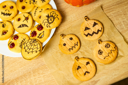 High angle view of decorated Halloween cookies and food table