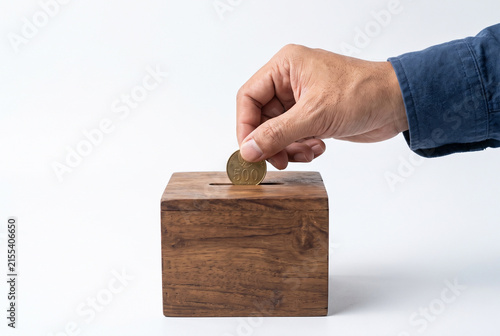 put coins in charity box, isolated on white background