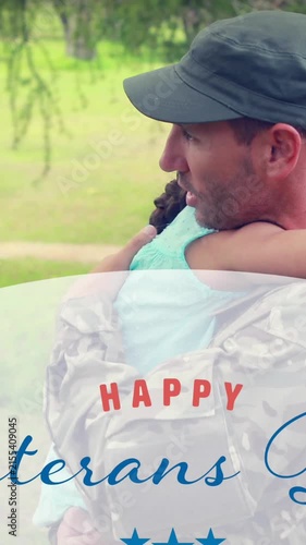 Composition of happy veterans day text and balloons, over soldier father embracing daughter