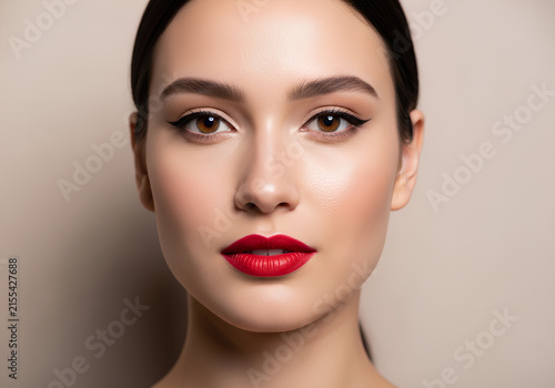 Beautiful woman with perfect skin and red lipstick portrait