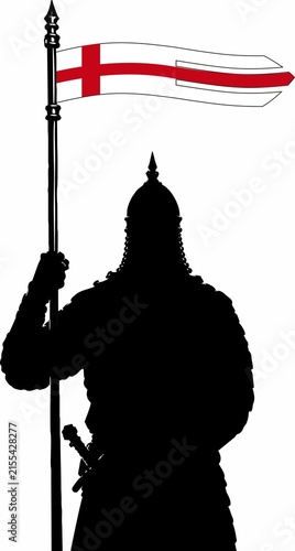 Fotografie Medieval soldier silhouette holding a banner with a red cross