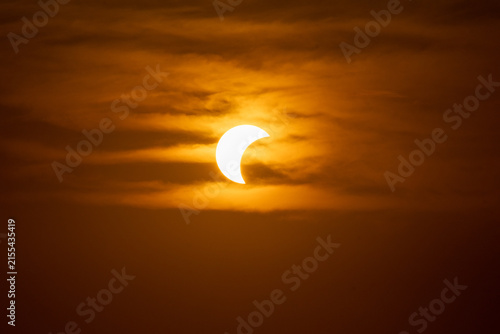 solar eclipse the moon obscures the sun sunset in the mountains