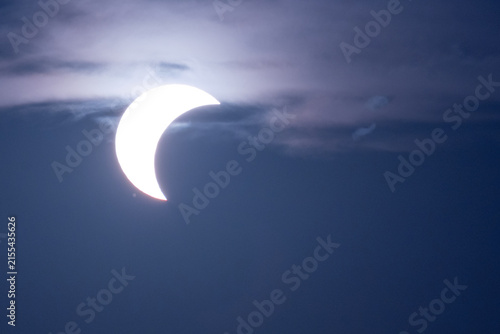 solar eclipse the moon obscures the sun sunset in the mountains