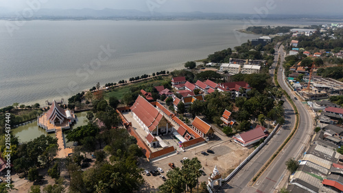Aerial view of Wat Sri Khom Kham temple and Phayao lake in Phayao province of Thailand. This lake is the largest freshwater lake in Northern Thailand and the fourth largest in the country.