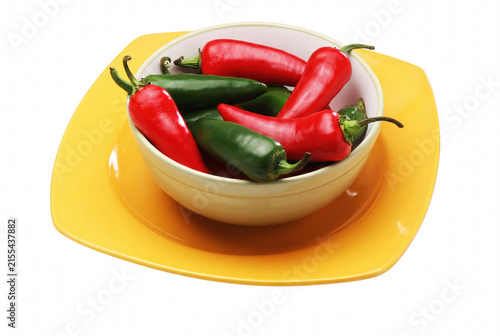 Foto Fresh Red and Green Chili Peppers in a Ceramic Bowl on a Yellow Plate