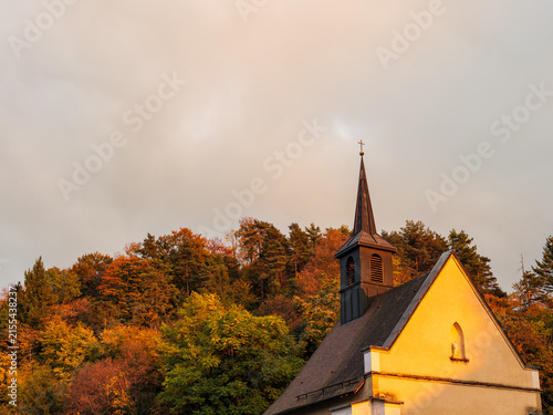 Autumn Chapel With Steeple In Warm Golden Evening Light