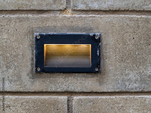 Recessed outdoor lighting in the brick wall