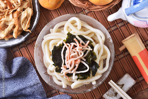 Cold udon noodles in glass bowl   