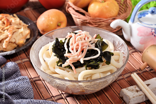 Cold udon noodles in glass bowl   
