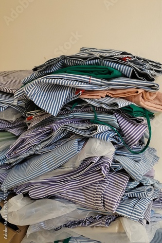 stack of neatly folded hospital linen prepared for use in a healthcare facility