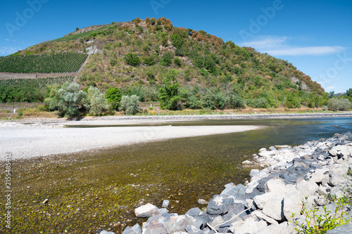 River Rhine with low water level, valley near Kaub, Germany, dry riverbed, extreme drought in Europe, impact freight transport and hinder shipping