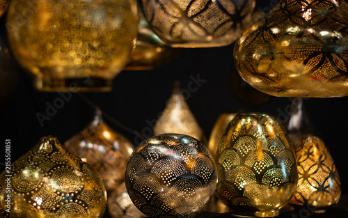 Handcrafted perforated lanterns illuminate the magic of an oriental market