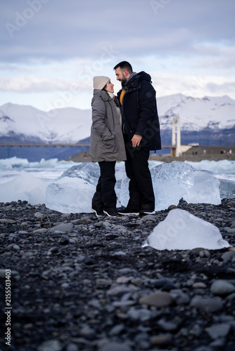 Romantic Couple Gazing at Each Other on Diamond Beach in Iceland