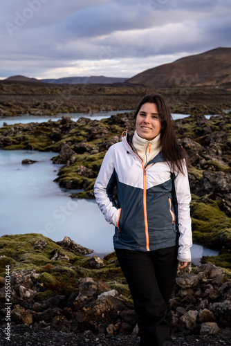 Portrait of Female Tourist near Milky Blue Geothermal Water in Iceland