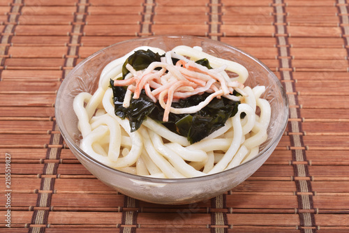 Cold udon noodles in glass bowl   