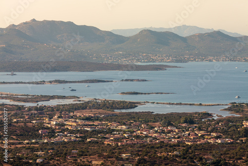 aerial full view of Olbia gulf with Murta Maria in foreground, landmark lighthouse and pittulongu in the background, pupular tourists attractions, holidays, vacations