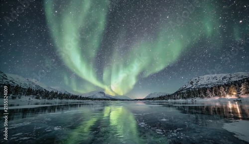 Aurora Borealis Illuminating a City Park Water Fountain at Night Under a Starry Arctic Sky