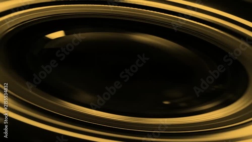 Close Up Macro View Of Camera Lens With Golden Lighting
A macro shot of a camera lens objective featuring concentric glass rings and golden light reflections against a dark background.