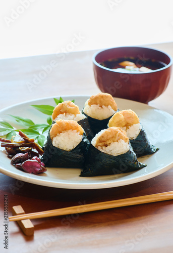 Shrimp tempura rice balls with miso soup on wooden table
