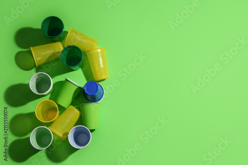 Different plastic cups on g...