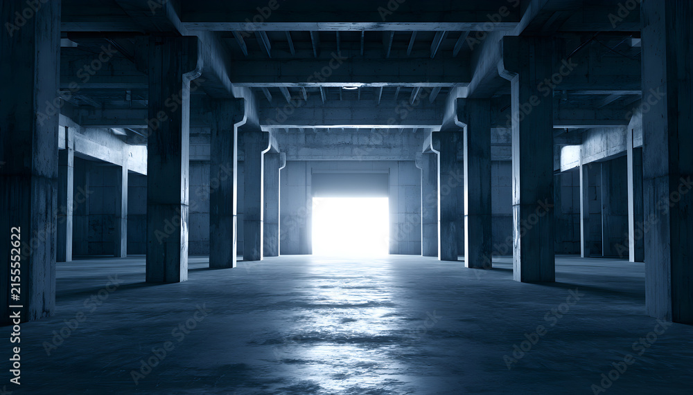Fototapeta premium Wide empty industrial warehouse interior with concrete structure, massive pillars. Bright light shines through far exit doorway. Sombre blue tones fill cold minimalist hall space. Large vacant