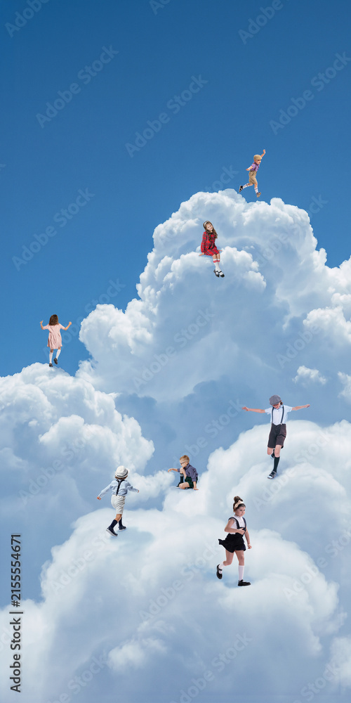 Fototapeta premium Children climbing and playing across giant cloud hills in blue sky. Concept of childhood freedom, imagination, physical confidence, summer play and children brand campaigns.
