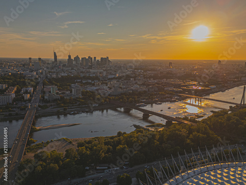 Foto Warsaw city capitol of Poland, pge stadium and Wisla river  at sunset