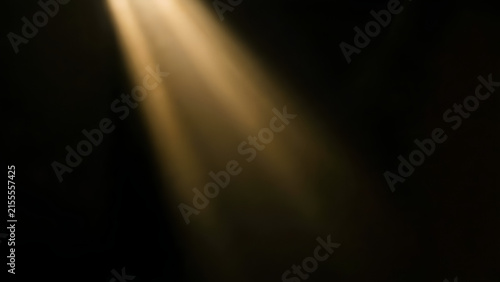 Dramatic Golden Light Beam Shining Through Darkness Background