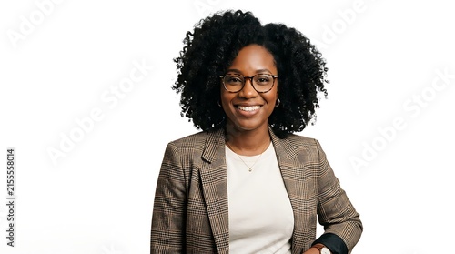Professional portrait of a smiling black woman with curly hair wearing a plaid blazer isolated on white background
