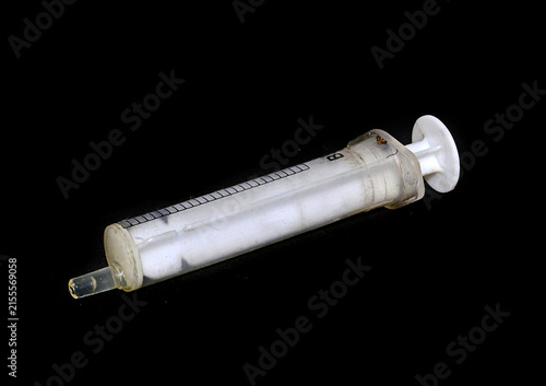 syringe isolated on black background