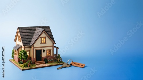 3D house model with keys on floating platform against blue sky backdrop for real estate marketing
