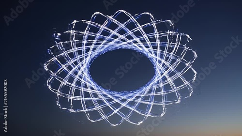 Blurry white light streaks against a dark blue twilight sky, abstract motion blur effect