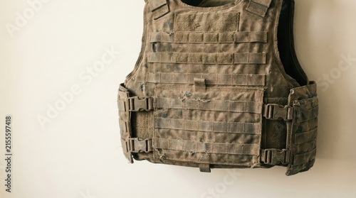 Принти на полотні Tactical bulletproof vest displayed on a neutral wall