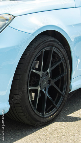 Canvastavla Light blue luxury sport car front fender and glossy black multi-spoke custom alloy wheel with low profile performance tire