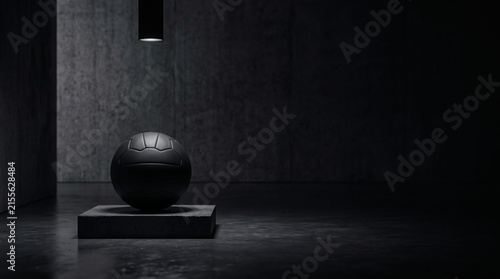 Black sports ball on pedestal in dark interior with copy space