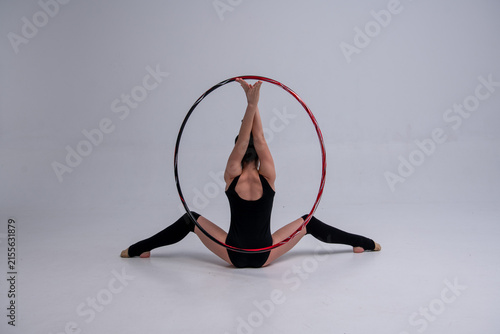 Obraz na płótnie a gymnast sits with a hoop