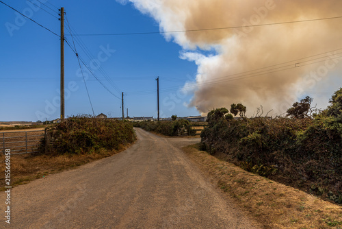 Smoke seen from a wildfire at Chapel Carn Brea near Lands End in Cornwall, during a hot dry summer