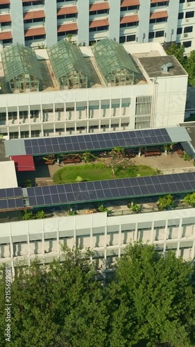 Large rooftop solar panel installation on Yogyakarta urban building