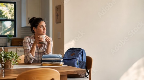 Woman enjoying morning coffee before starting daily routine