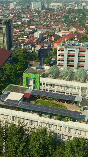 Solar panels covering rooftop of urban building in Yogyakarta