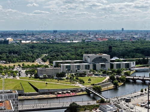 Aerial view of the German Chancellery surrounded by green parkland and the Spree river in Berlin, Berlin, Germany.