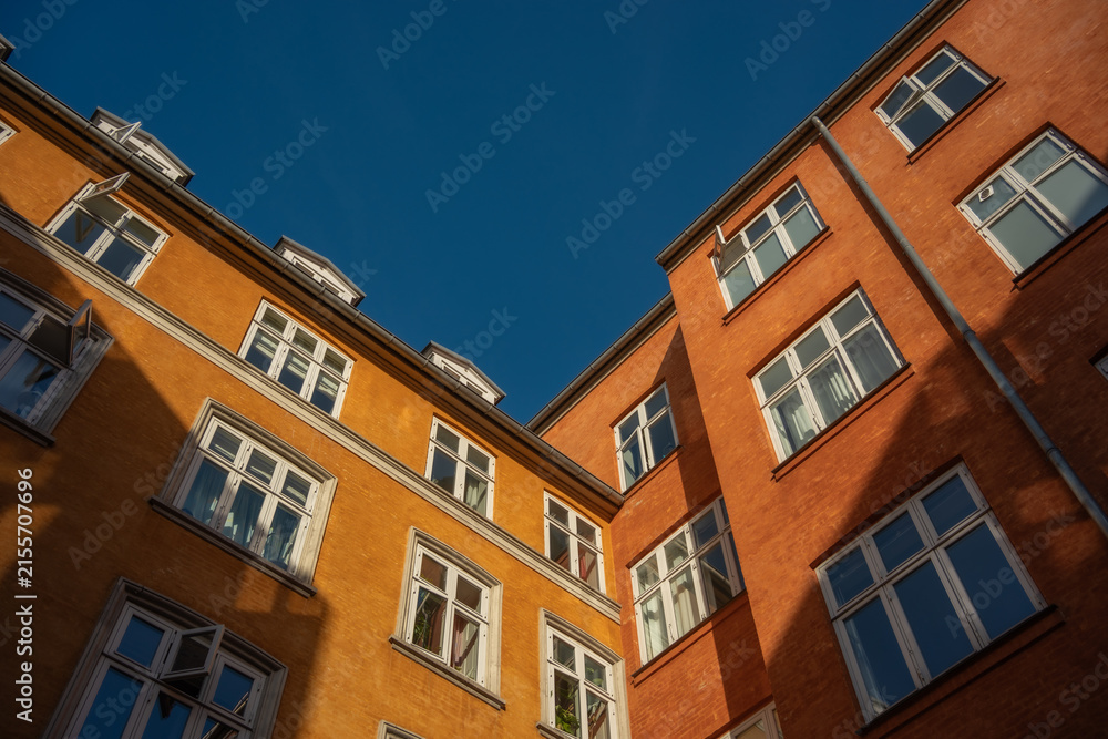 Fototapeta premium Stunning Architectural Facades Under a Clear Blue Sky