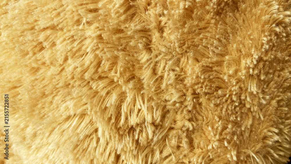 Fototapeta premium Warm caramel brown fluffy faux fur textile background texture