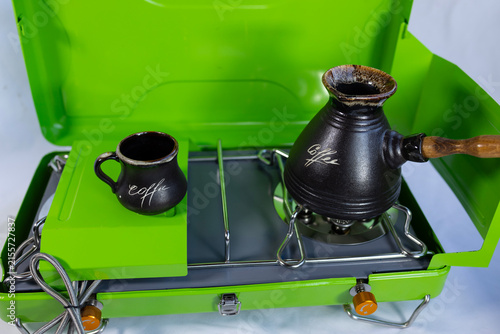 A turk for making morning coffee on a gas stove for camping, the concept of indoor outdoor tourism, a lifestyle of travel