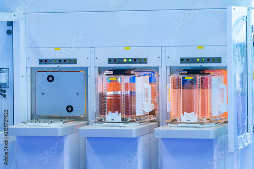 Silicon Wafer Under Cleanroom Fabrication in plastic holder box with Semiconductor inspection equipment,integrated circuits to manufacture CPU and GPU