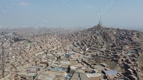 Vast panorama of a densely populated hillside shantytown in san martin de porres district, lima