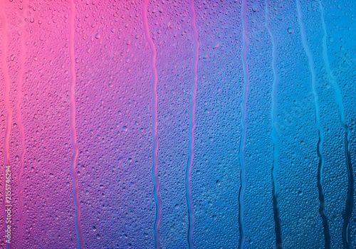 Wet Glass Surface. Condensation Texture. Vibrant Gradient Background. Neon Color Droplets. Abstract Design Element.